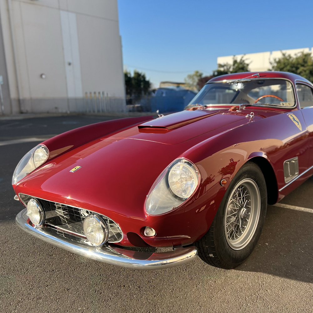 Red classic Ferrari showcasing completed restoration craftsmanship