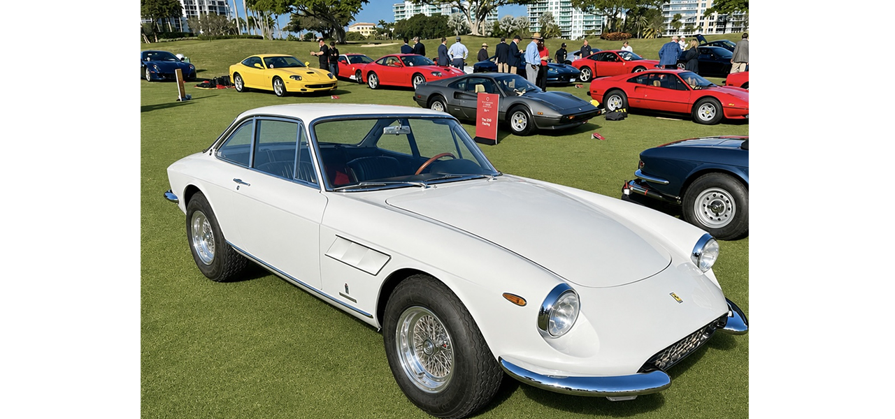 White classic Ferrari displayed at a concours event